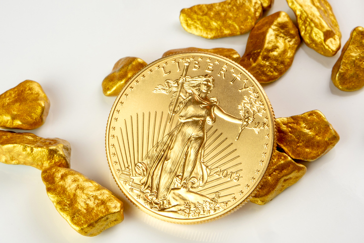 Golden American Eagle One Ounce Coin Laying On A Heap Of Golden Nuggets, Golden Ore On White Background Isolated With Plenty Copy Space