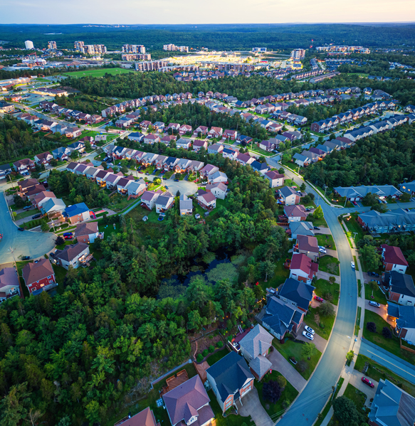 Aerial View Of A Suburban Landscape At Dusk.