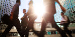 Blurred Silhouettes Of Businesspeople Walking In Hong Kong’s Central District Elevated Walkway