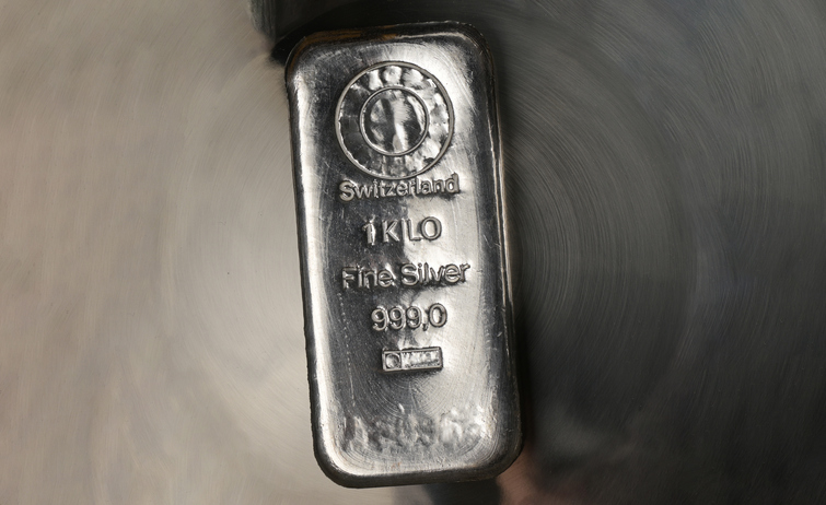 Cast Silver Bar Weighing One Kilogram On An Abstract Metal Background.